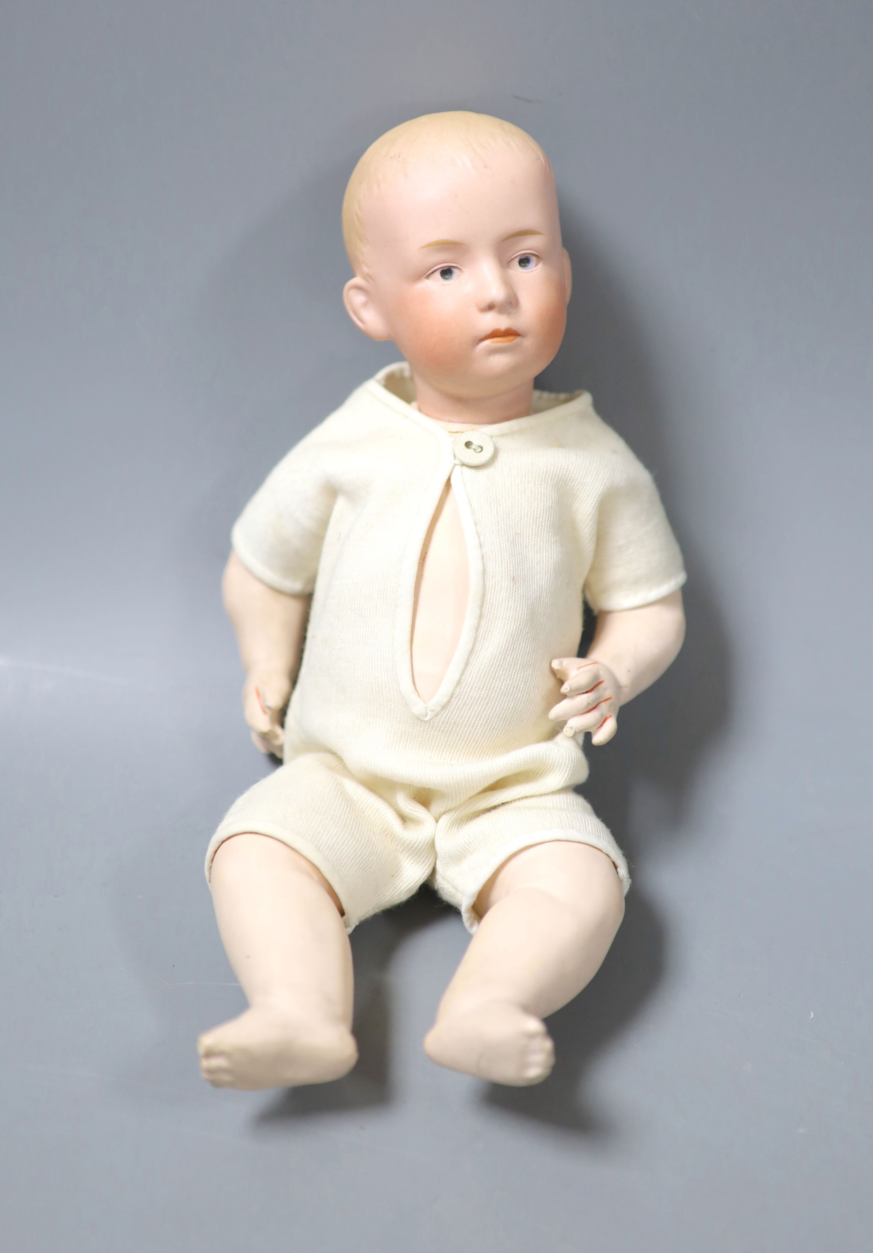 A Rose O'Neil Kewpie doll, arms detached, 26cm